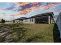 Spacious backyard with screened patio and grassy area at 12821 Bergstrom Bay Dr, Riverview, FL 33579