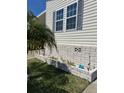 Landscaped area with brick planter and small plants at 13225 101St St # 482, Largo, FL 33773