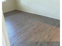 Simple bedroom with wood-look floors at 8304 Bardmoor Blvd # 104, Seminole, FL 33777