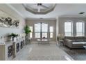 Bright living room featuring marble floors and large windows at 2717 Via Cipriani # 631B, Clearwater, FL 33764
