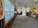 Living room undergoing renovation with exposed walls and flooring at 108 11Th Ave, St Pete Beach, FL 33706