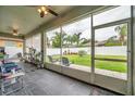 Relaxing screened porch overlooking the backyard at 3822 Salida Delsol Dr, Sun City Center, FL 33573