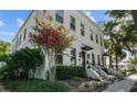 Charming white brick building with lush landscaping and pink flowers at 423 21St N Ave, St Petersburg, FL 33704