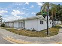 White single-story home on corner lot with landscaping at 5396 Acacia N Trl, Pinellas Park, FL 33782