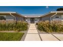 Beautiful single-story home with walkway and stylishly landscaped front yard at 3931 38Th S Way, St Petersburg, FL 33711