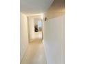 Bright hallway with light colored carpet leading to living area at 2220 Spanish Dr # 36, Clearwater, FL 33763