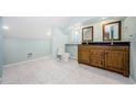 This bathroom features a double vanity, tile floor, and ample space at 49 W Boyer St, Tarpon Springs, FL 34689