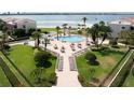 Resort-style pool with lush landscaping and bay views at 830 S Gulfview Blvd # 102, Clearwater, FL 33767