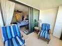 Relaxing balcony with patio furniture and view of bedroom at 1460 Gulf Blvd # 1212, Clearwater Beach, FL 33767