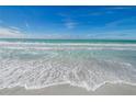 Waves gently lapping on the sandy shore at 1460 Gulf Blvd # 1212, Clearwater Beach, FL 33767