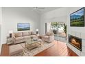 Living room with fireplace and sliding glass doors at 3051 Overlook Pl, Clearwater, FL 33760