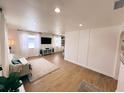 Bright living room with hardwood floors, white walls, and comfy seating at 811 40Th S Ave, St Petersburg, FL 33705