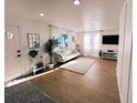 Light-filled living room featuring hardwood floors and white walls at 811 40Th S Ave, St Petersburg, FL 33705