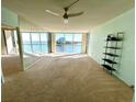 Living room boasts water views, ceiling fan, and modern shelving at 100 Pierce St # 703, Clearwater, FL 33756