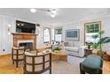 Spacious living room features hardwood floors, fireplace, and comfortable seating at 716 14Th Ne Ave, St Petersburg, FL 33701