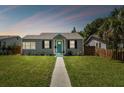 Renovated craftsman home with gray siding and teal door at 4320 3Rd N Ave, St Petersburg, FL 33713