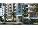 Building entrance with parking and landscaping at 411 E Shore Drive # Ph10, Clearwater Beach, FL 33767