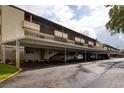 Assigned covered parking for residents in front of this Sunshine Terrace condo complex at 1245 S Martin Luther King Jr Ave # 304, Clearwater, FL 33756