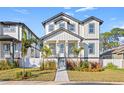 Two-story house with white siding, black accents and a landscaped yard at 125 48Th N Ave, St Petersburg, FL 33703