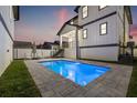 Inviting, rectangular pool with surrounding stone patio at 135 48Th Ave, St Petersburg, FL 33703