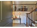 Bright and spacious entryway with elegant staircase and wood flooring at 18 Franklin S Ct # A, St Petersburg, FL 33711