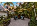 Lush backyard features a cozy fire pit area, perfect for outdoor entertaining at 546 18Th Ne Ave, St Petersburg, FL 33704