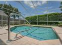 Inviting screened-in pool area, perfect for relaxation at 4050 Eagle Cove East Dr, Palm Harbor, FL 34685