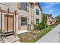 Townhome entrance with steps, landscaping, and a walkway at 103 Brigadoon Dr, Clearwater, FL 33759