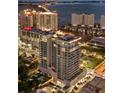 Stunning aerial view of a luxury high-rise condominium offering city and waterfront views at 540 N Tamiami Trl # 1702, Sarasota, FL 34236