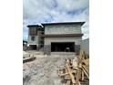 Modern two-story home with attached garage and stone accents at 2121 Bayou Grande Ne Blvd, St Petersburg, FL 33703