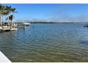 Tranquil waterfront view with a dock, and clear, calm water at 2121 Bayou Grande Ne Blvd, St Petersburg, FL 33703