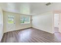 Living room with hardwood floors and bay window at 10162 115Th Ave, Largo, FL 33773