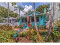 Quaint bungalow with lush tropical landscaping and unique garden art at 407 10Th Ne Ave, St Petersburg, FL 33701