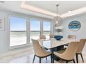 Bright dining room with ocean view, seating for six at 5000 Gulf Blvd # 704, St Pete Beach, FL 33706