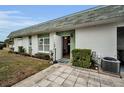 Landscaped exterior of a home with a green front door at 7787 39Th N Ter # 7787, St Petersburg, FL 33709