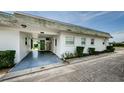 View of the home's side entrance and carport at 7787 39Th N Ter # 7787, St Petersburg, FL 33709