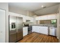 Modern kitchen featuring stainless steel appliances and granite countertops at 10608 Bucks Run, New Port Richey, FL 34654