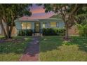 House exterior at dusk, showcasing landscaping at 2827 29Th N Ave, St Petersburg, FL 33713
