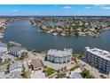 Aerial view of waterfront property with private boat dock at 123 99Th Ave, Treasure Island, FL 33706