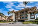 Condo building exterior showcasing multiple levels and balconies at 3021 Countryside Blvd # 28A, Clearwater, FL 33761