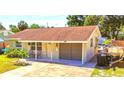 Tan single story house with carport and small yard at 6220 5Th S Ave, St Petersburg, FL 33707