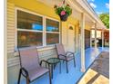 Covered porch with two chairs and a small table at 6220 5Th S Ave, St Petersburg, FL 33707