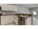 Kitchen features granite countertops and modern cabinetry at 2711 Coldstone Ln, Holiday, FL 34691