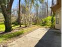Backyard patio with access to a wooded area at 5930 Precious View Ct, New Port Richey, FL 34655