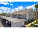 Exterior view of the building and parking at 7712 Hillside Ct # 202, Hudson, FL 34667