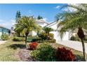 Beautiful single-Gathering home with lush landscaping and a well-maintained lawn at 2529 Sandy Hill Ct, Holiday, FL 34691
