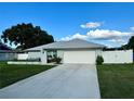 Well-maintained single-story house boasting a lovely yard and a convenient two-car garage at 10234 Bedford Rd, Spring Hill, FL 34608