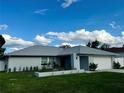 Inviting single-story home showcasing a freshly painted exterior and an attached garage at 10234 Bedford Rd, Spring Hill, FL 34608