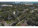 Aerial view showcasing home's location in a tree-lined neighborhood at 804 S Fremont Ave, Tampa, FL 33606