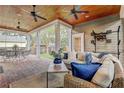 Spacious covered porch with brick patio and comfortable seating at 804 S Fremont Ave, Tampa, FL 33606